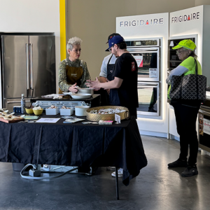 Chef Kimlai Yingling demonstrates safety features as she boils water with sales associates and consumers at The Appliance Outlet in Riverside, CA. 