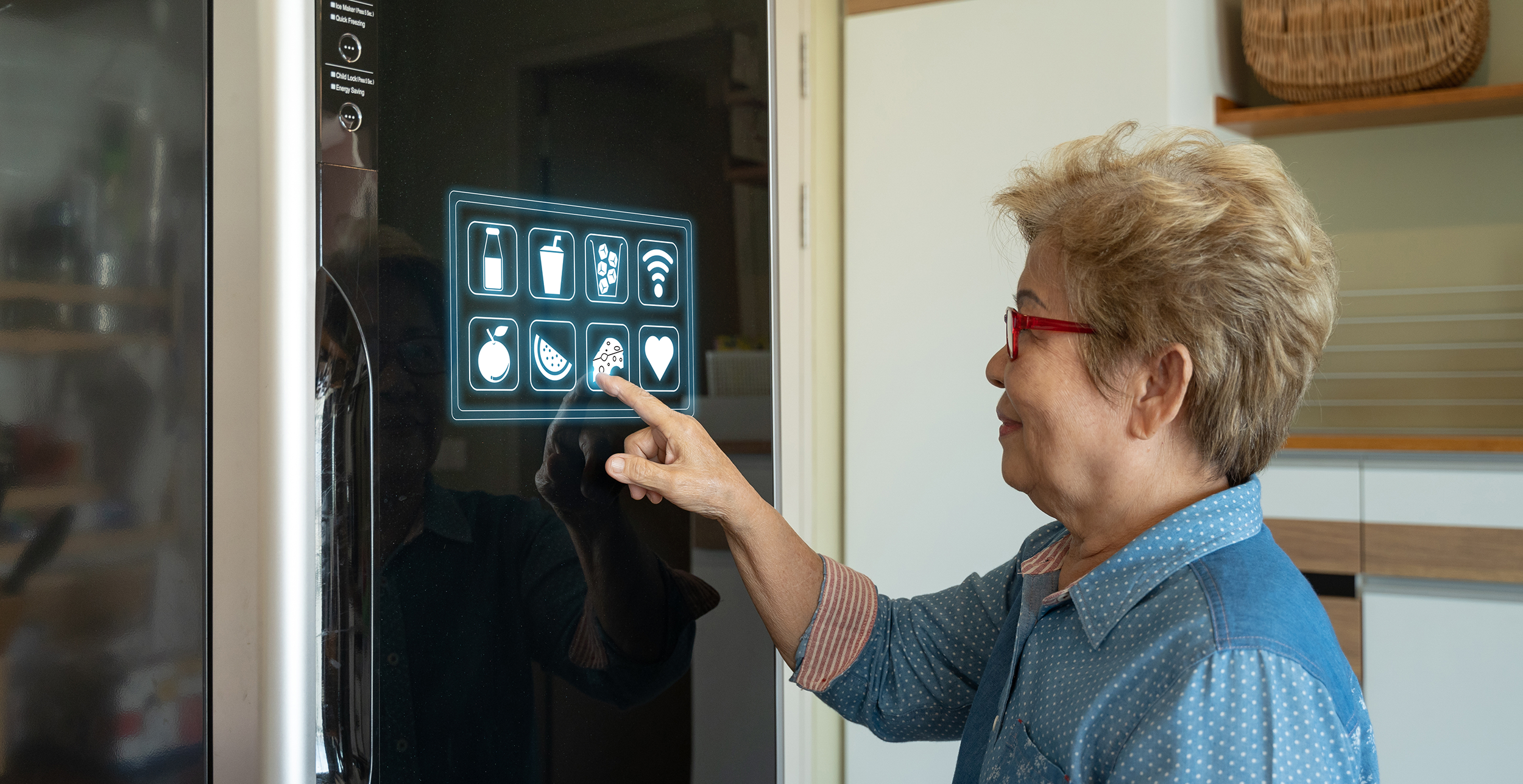 Woman tapping control panel of smart fridge